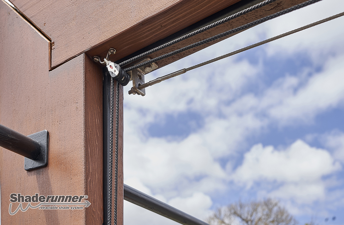 Marine-grade pulley and stainless-steel cable detail