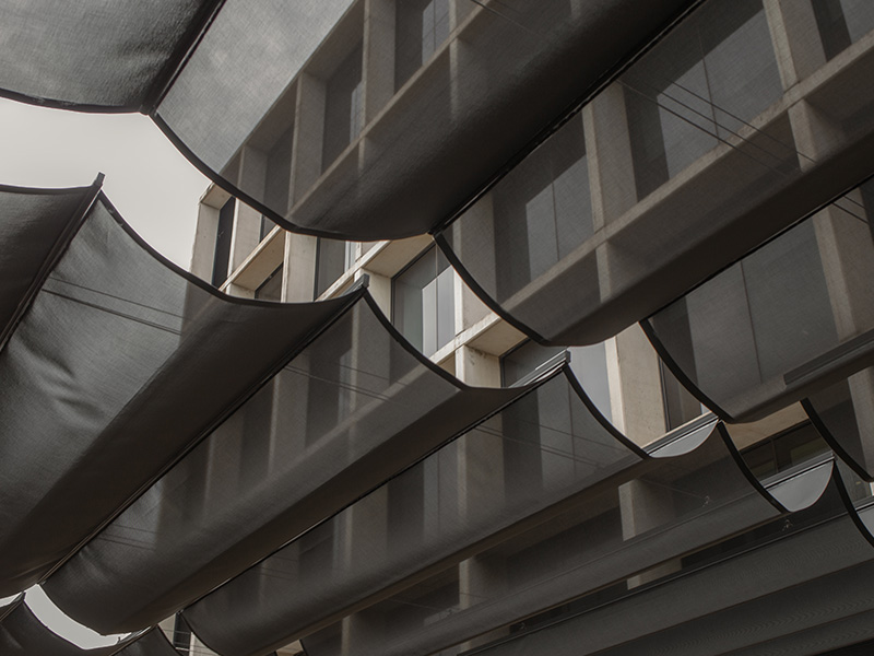 Close view of a Shaderunner canopy running on stainless-steel wires